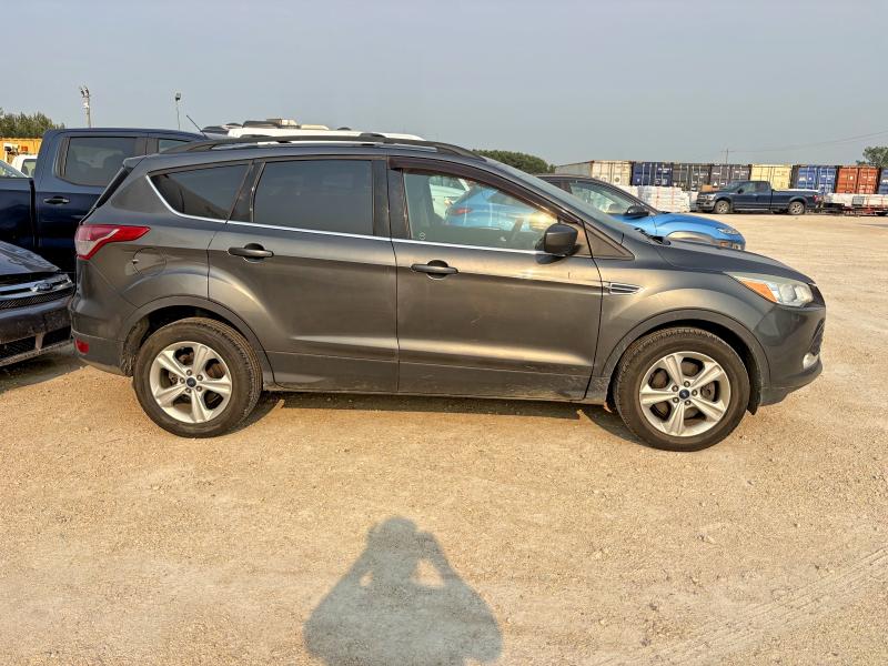 FORD ESCAPE 2015 with VIN 1FMCU9GX3FUB76577 - Photo from auction