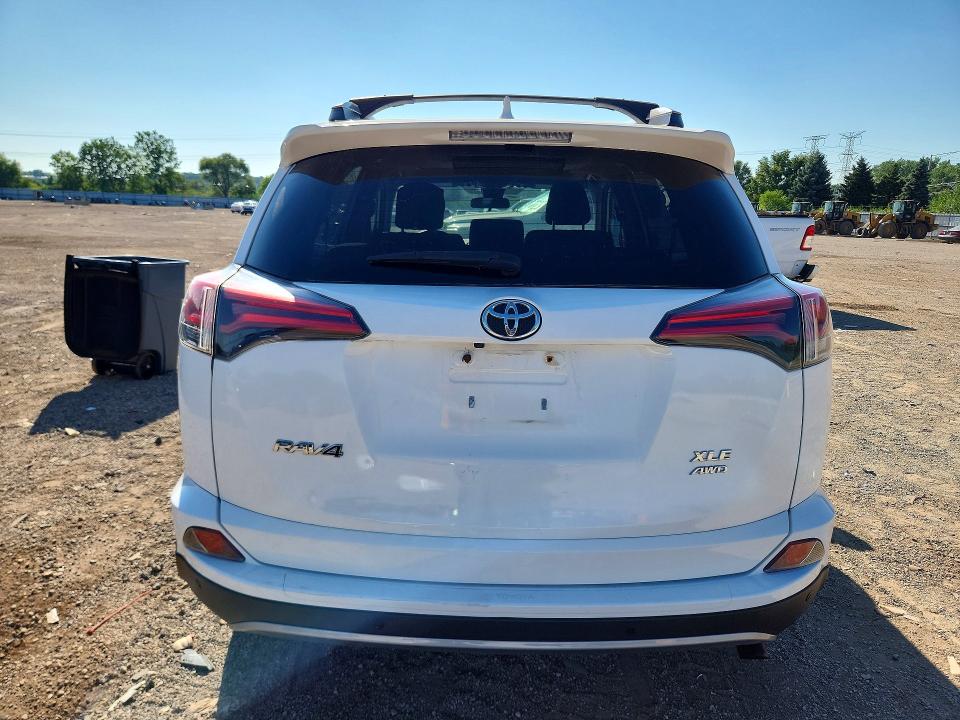 Photo 6 from auction – 2018 TOYOTA RAV4 with VIN 2T3RFREV5JW856809