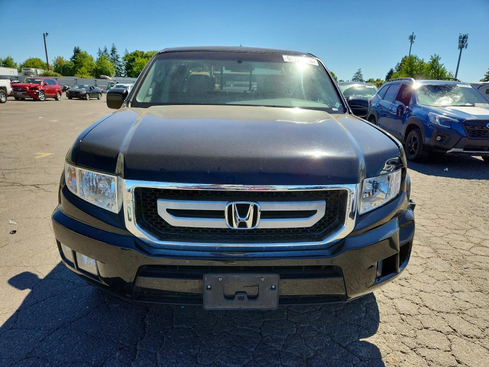 Photo 5 from auction – 2010 HONDA RIDGELINE with VIN 5FPYK1F52AB013543