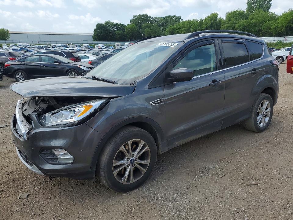 FORD ESCAPE 2017 with VIN 1FMCU9GD0HUF06166 - Photo from auction