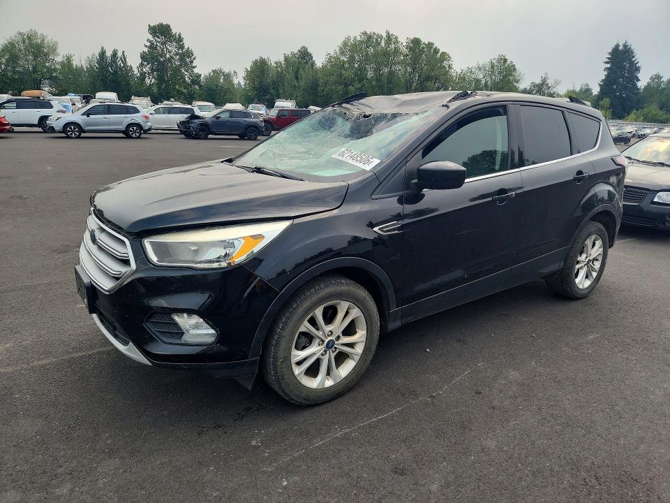 FORD ESCAPE 2018 with VIN 1FMCU9GD3JUA11823 - Photo from auction