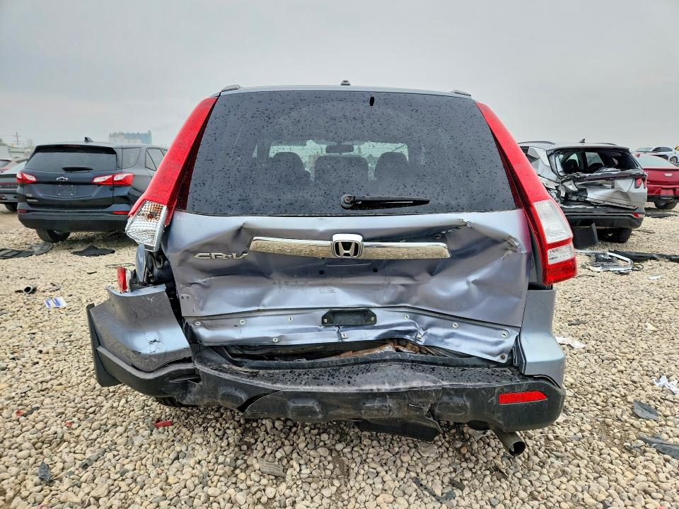 Photo 6 from auction – 2007 HONDA CR-V with VIN JHLRE385X7C006636