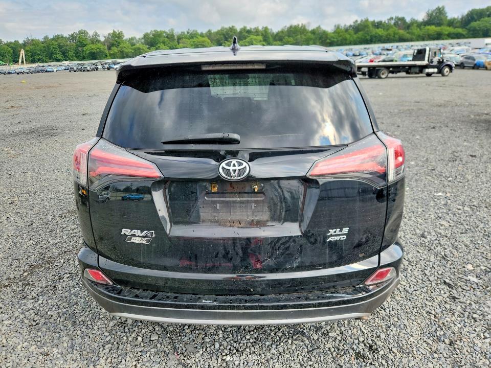 Photo 6 from auction – 2018 TOYOTA RAV4 with VIN 2T3RFREV2JW807793