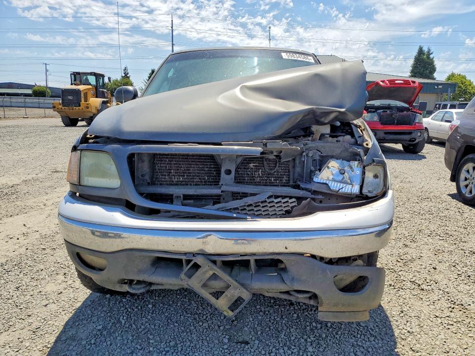 Photo 5 from auction – 2002 FORD F150 with VIN 1FTRX18L72NB90599