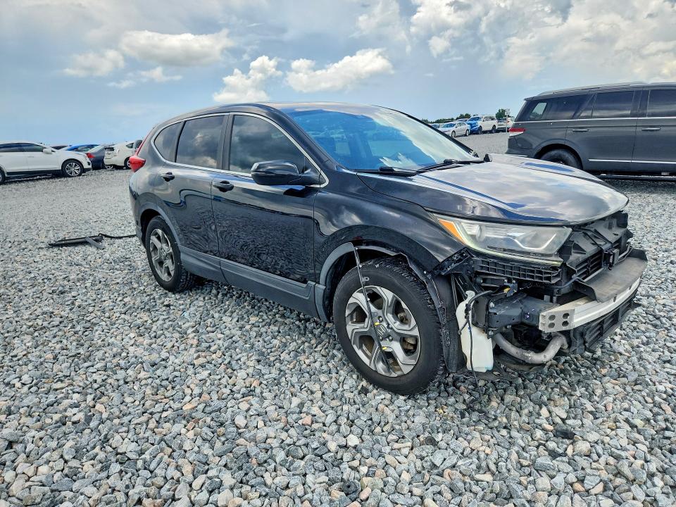 Photo 4 from auction – 2018 HONDA CR-V with VIN 7FARW1H51JE040459