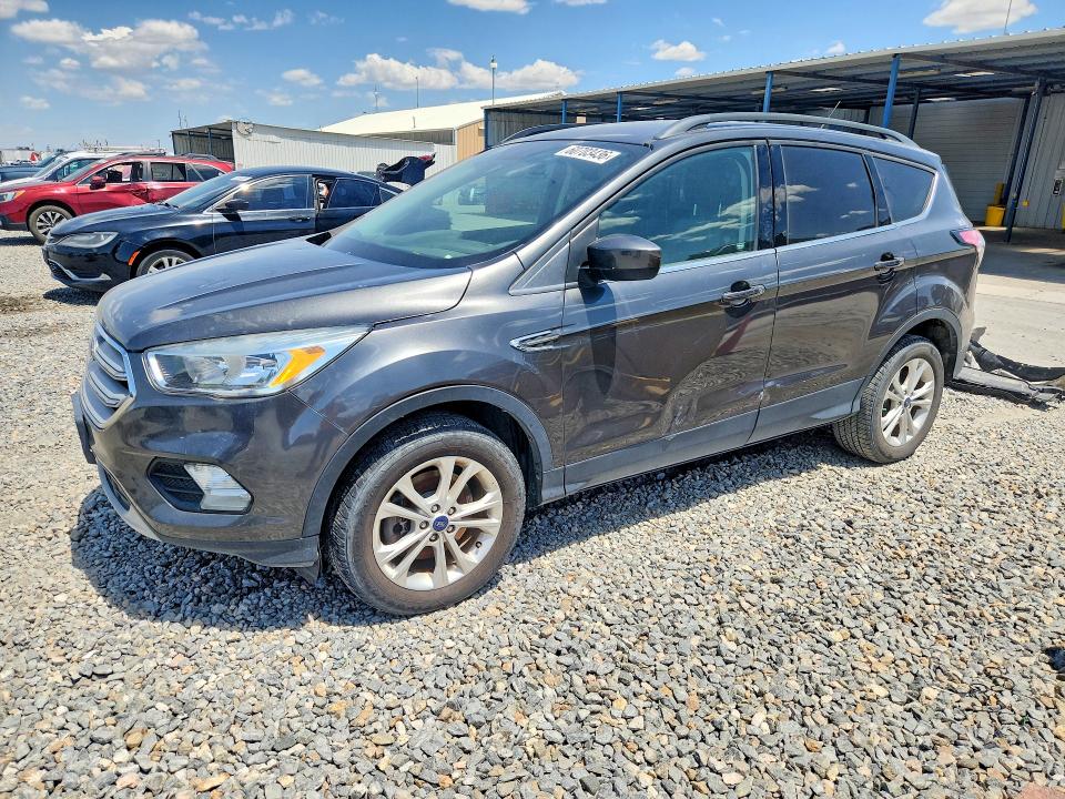 FORD ESCAPE 2018 with VIN 1FMCU9GDXJUB46880 - Photo from auction