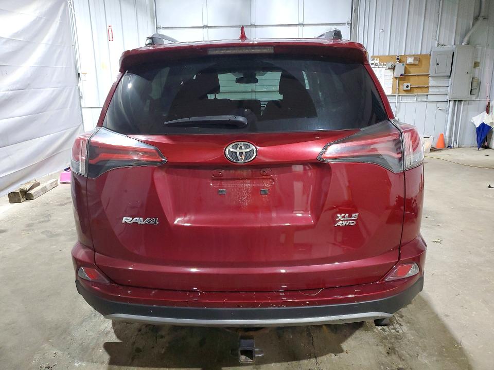 Photo 6 from auction – 2018 TOYOTA RAV4 with VIN 2T3RFREV8JW728967