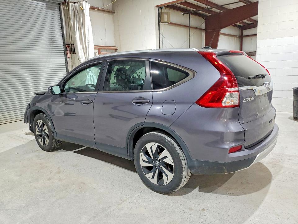 Photo 2 from auction – 2016 HONDA CR-V with VIN 5J6RM4H99GL041395