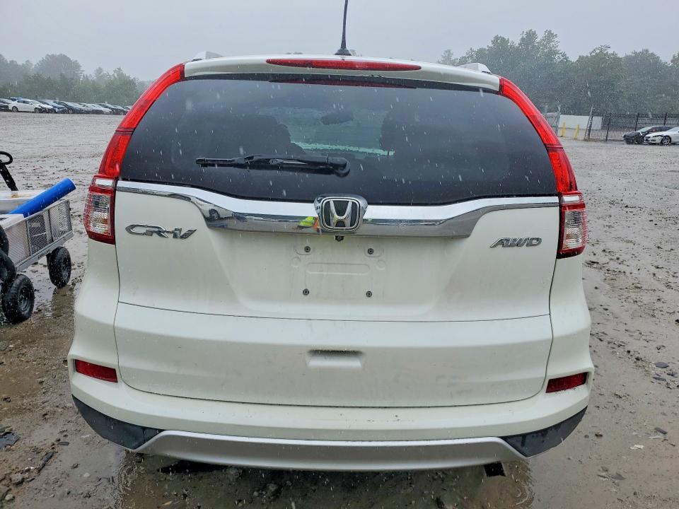 Photo 6 from auction – 2016 HONDA CR-V with VIN 5J6RM4H73GL030620