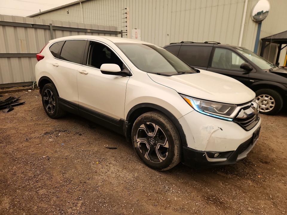 Photo 4 from auction – 2018 HONDA CR-V with VIN 2HKRW1H33JH001464