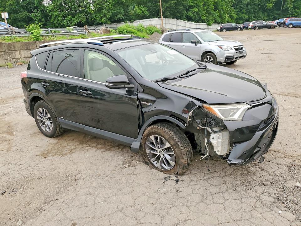Photo 4 from auction – 2016 TOYOTA RAV4 HV with VIN JTMRJREV3GD008755