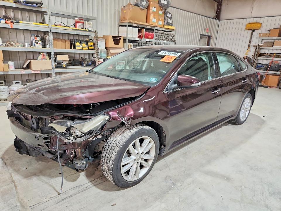 TOYOTA AVALON 2014 with VIN 4T1BK1EB6EU136390 - Photo from auction