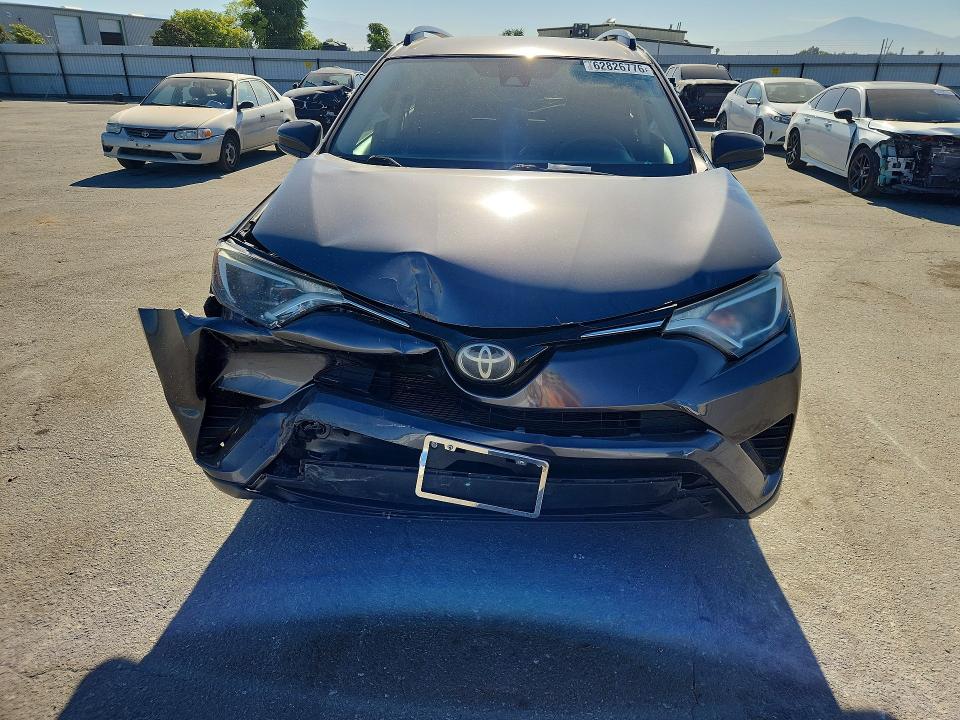 Photo 5 from auction – 2018 TOYOTA RAV4 with VIN JTMZFREV8JJ200974