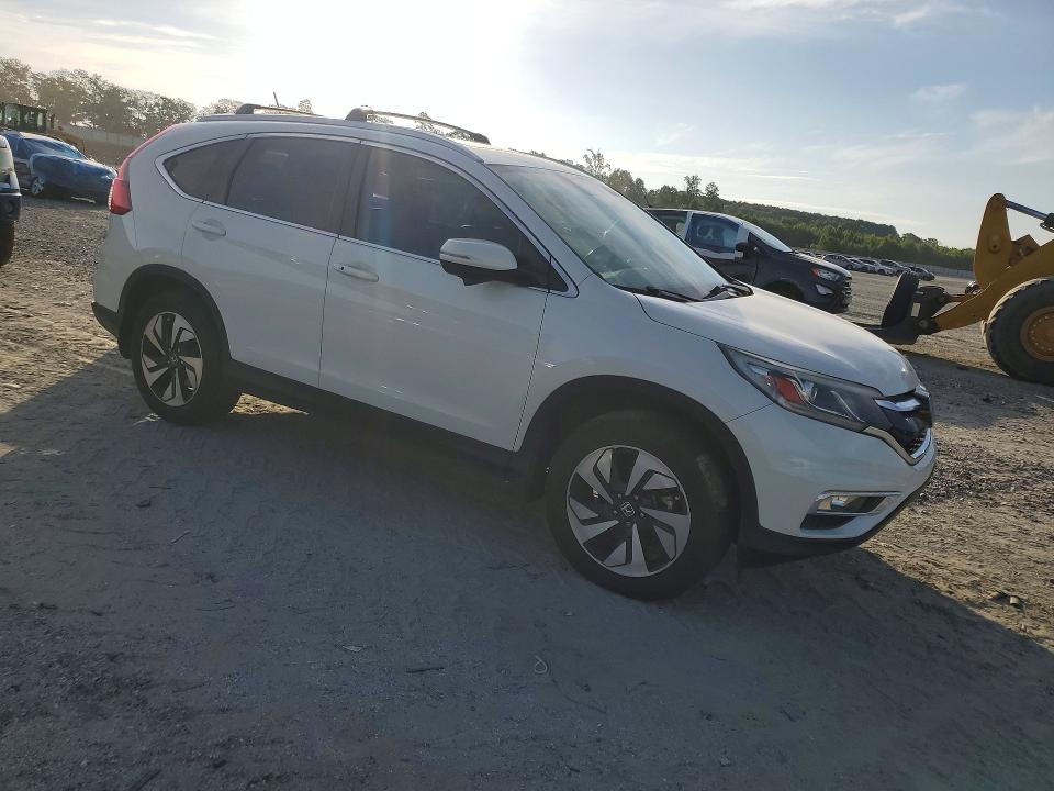 Photo 4 from auction – 2016 HONDA CR-V with VIN 5J6RM4H90GL090632