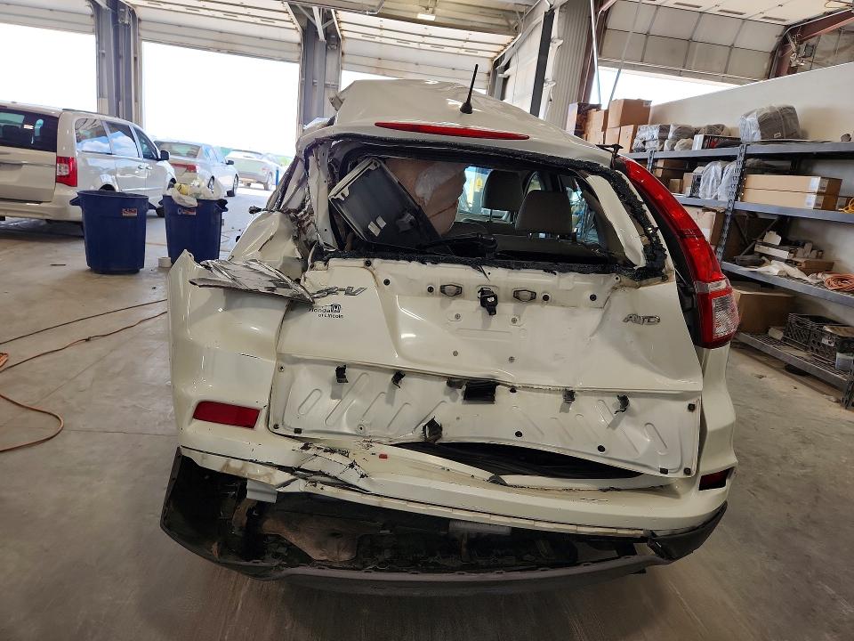 Photo 6 from auction – 2016 HONDA CR-V with VIN 5J6RM4H34GL135857