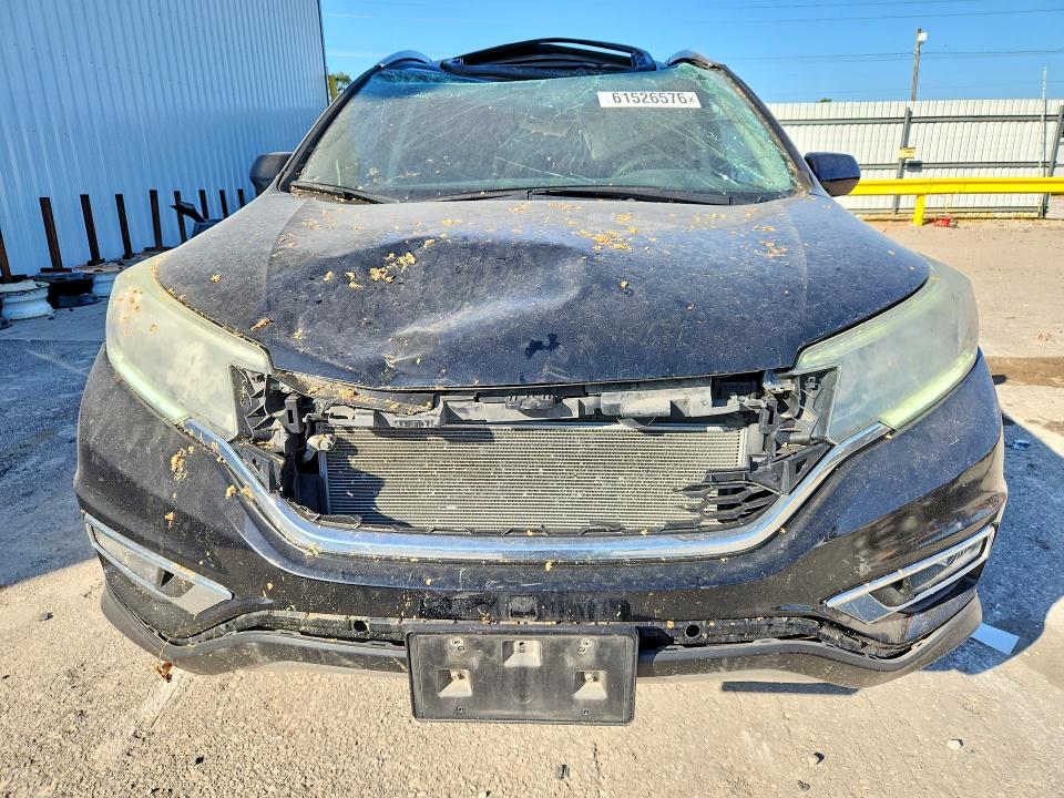 Photo 5 from auction – 2016 HONDA CR-V with VIN 5J6RM4H74GL071970