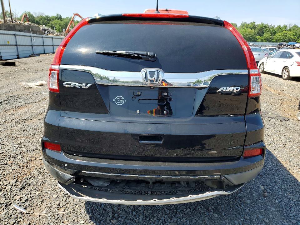 Photo 6 from auction – 2015 HONDA CR-V with VIN 2HKRM4H71FH633669