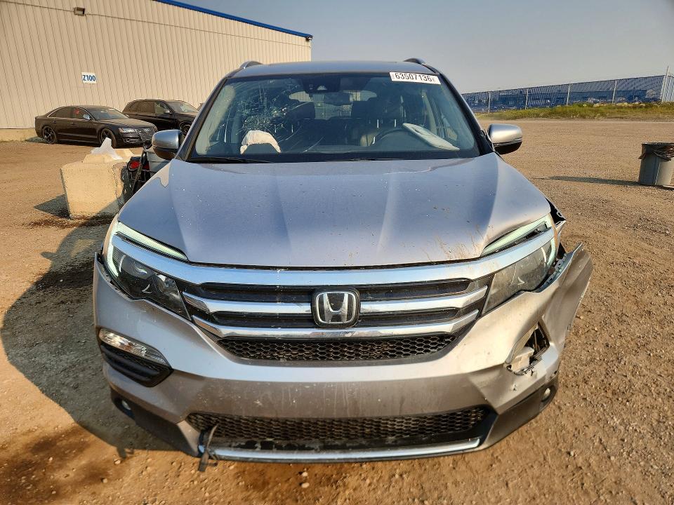 Photo 5 from auction – 2018 HONDA PILOT with VIN 5FNYF6H90JB502341