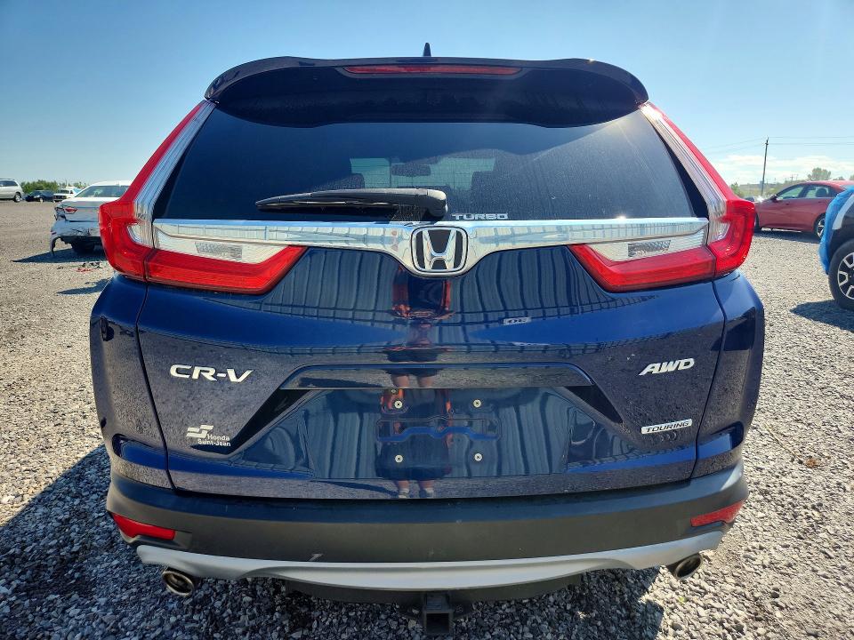 Photo 6 from auction – 2018 HONDA CR-V with VIN 2HKRW2H97JH101609