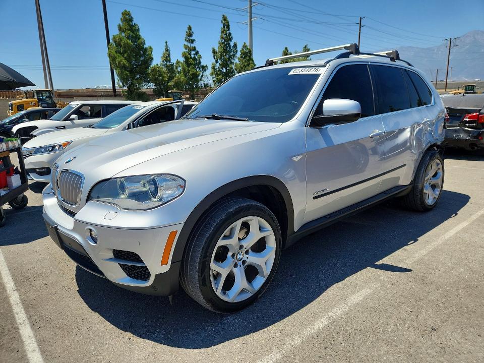 BMW X5 2013 with VIN 5UXZV8C52D0C14865 - Photo from auction
