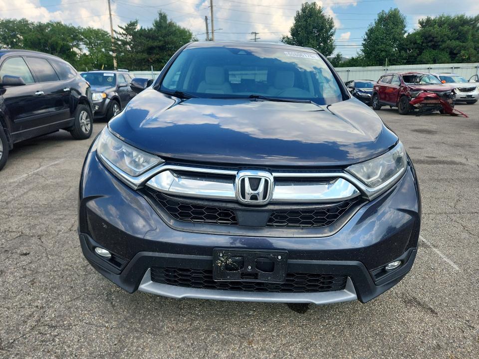 Photo 5 from auction – 2018 HONDA CR-V with VIN 7FARW2H53JE038976