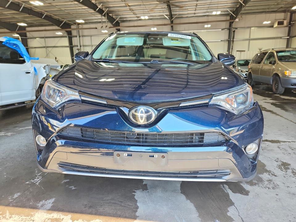 Photo 5 from auction – 2018 TOYOTA RAV4 with VIN 2T3RFREV6JW815783