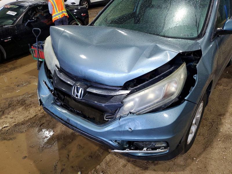 Photo 11 from auction – 2015 HONDA CR-V with VIN 2HKRM3H51FH555905