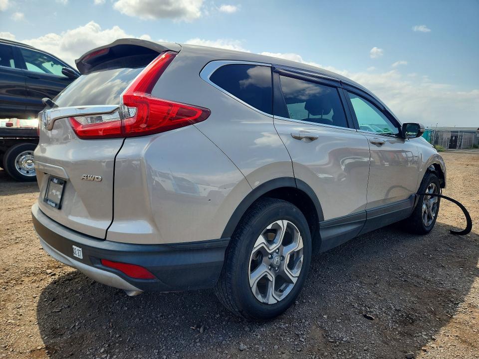 Photo 3 from auction – 2018 HONDA CR-V with VIN 2HKRW2H52JH665343