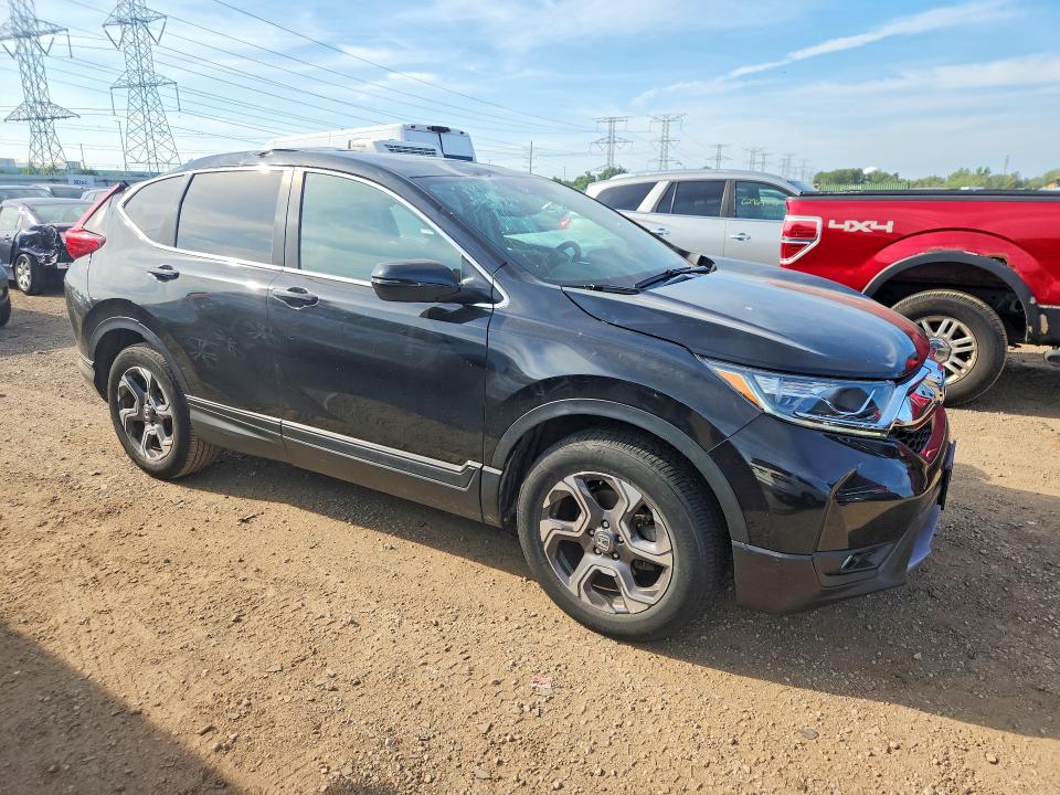 Photo 4 from auction – 2018 HONDA CR-V with VIN 7FARW2H81JE006571