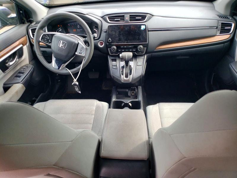 Photo 8 from auction – 2018 HONDA CR-V with VIN 7FARW2H54JE063949