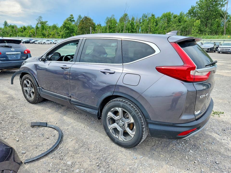 Photo 2 from auction – 2018 HONDA CR-V with VIN 5J6RW1H52JA007792
