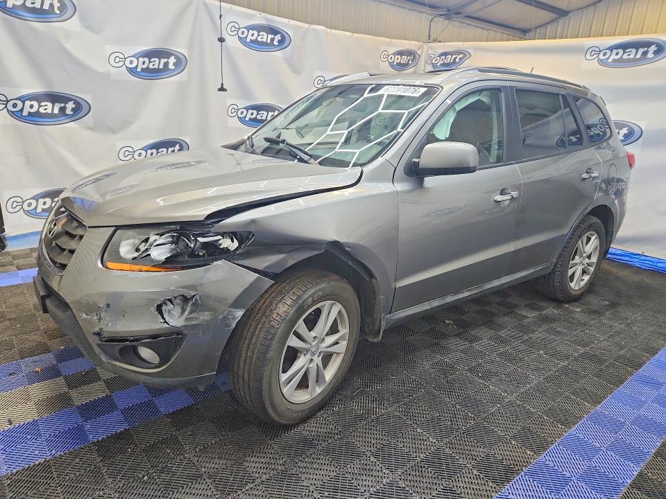HYUNDAI SANTA FE 2011 with VIN 5XYZK4AG9BG034679 - Photo from auction
