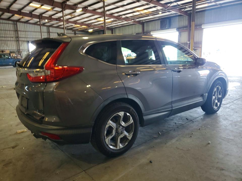Photo 3 from auction – 2018 HONDA CR-V with VIN 7FARW1H56JE034334