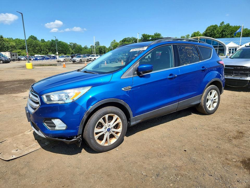 FORD ESCAPE 2018 with VIN 1FMCU9H91JUB63402 - Photo from auction