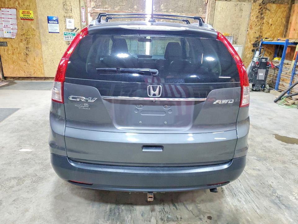 Photo 6 from auction – 2014 HONDA CR-V with VIN 2HKRM4H71EH688895