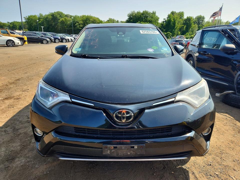 Photo 5 from auction – 2018 TOYOTA RAV4 with VIN 2T3RFREV6JW803195