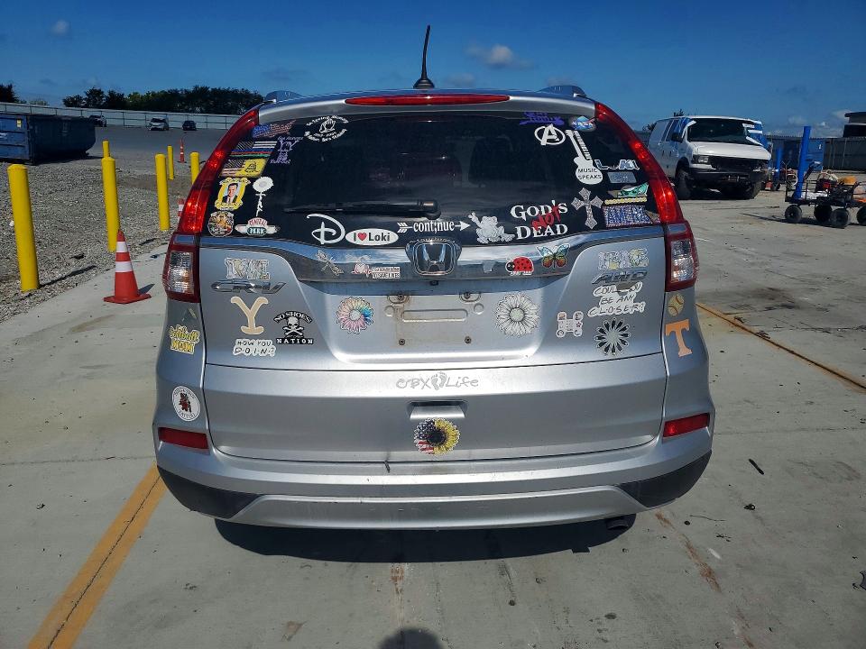 Photo 6 from auction – 2015 HONDA CR-V with VIN 2HKRM4H74FH615859