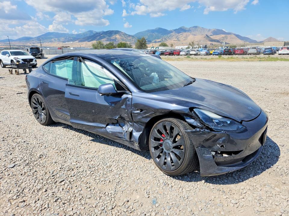 Photo 4 from auction – 2022 TESLA MODEL 3 with VIN 5YJ3E1ECXNF231939