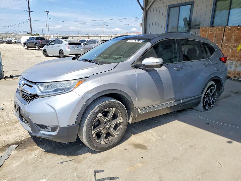 HONDA CR-V 2017 with VIN 7FARW1H9XHE022670 - Photo from auction