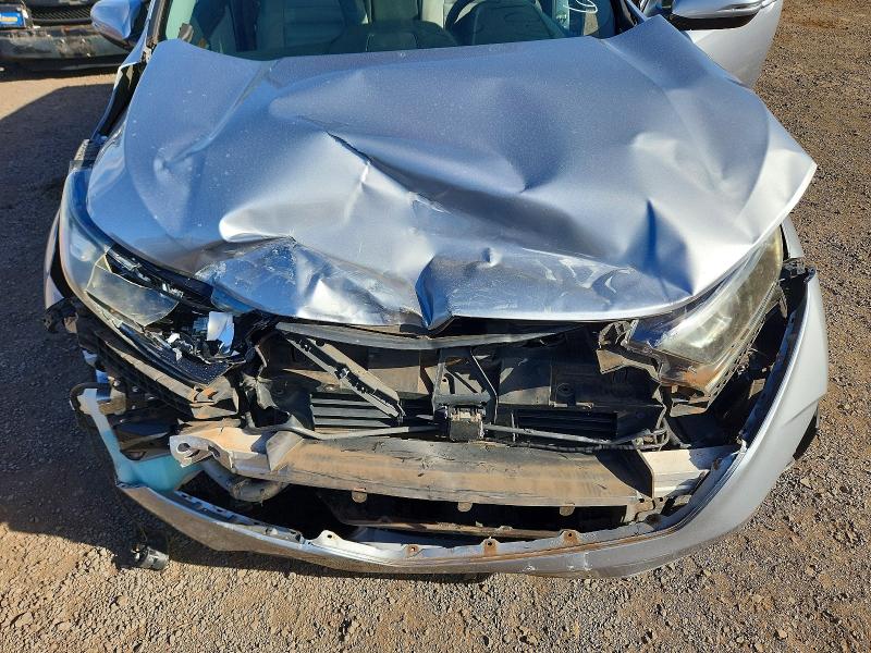 Photo 12 from auction – 2018 HONDA CR-V with VIN 7FARW1H55JE039749