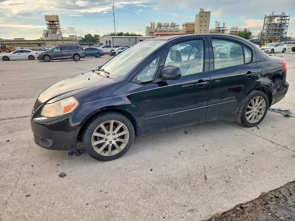 SUZUKI SX4 2011 with VIN JS2YC5A21B6303012 - Photo from auction