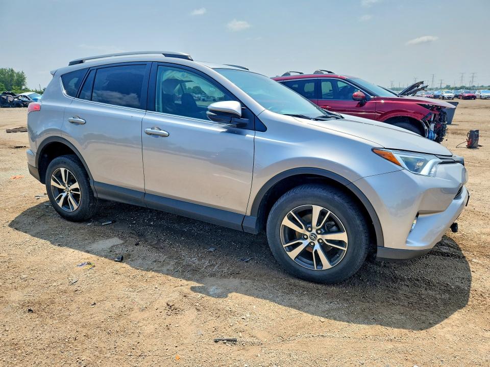 Photo 4 from auction – 2018 TOYOTA RAV4 with VIN 2T3RFREV2JW704955