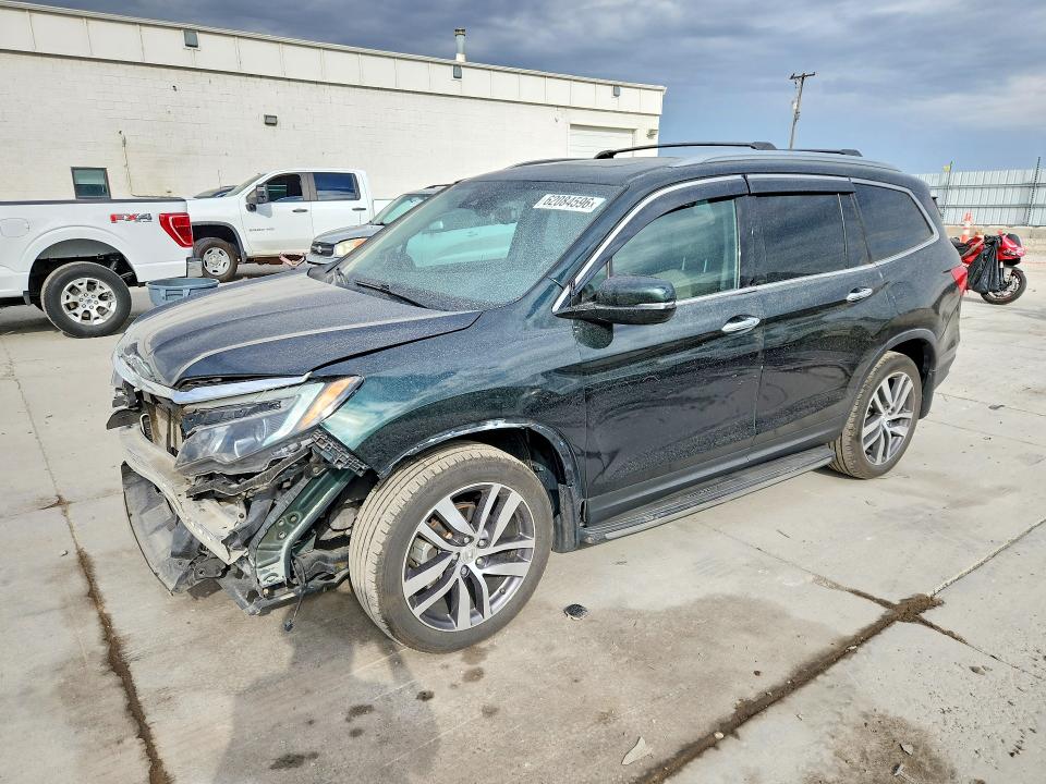 HONDA PILOT 2016 with VIN 5FNYF6H01GB066674 - Photo from auction