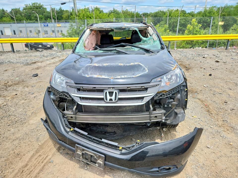 Photo 5 from auction – 2014 HONDA CR-V with VIN 5J6RM4H56EL071044