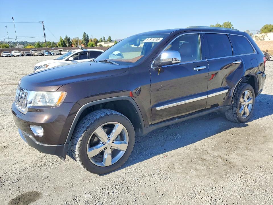 JEEP GRAND CHEROKEE 2011 with VIN 1J4RR6GG4BC703194 - Photo from auction