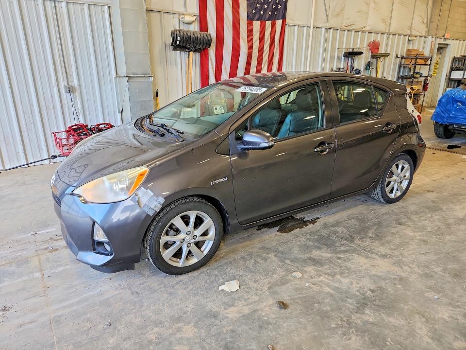 TOYOTA PRIUS C 2012 с VIN JTDKDTB37C1030570 - Снимка от търг