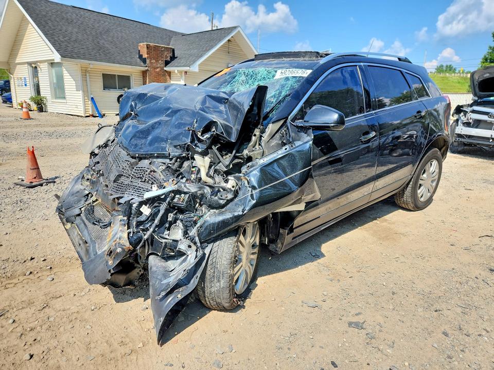 CADILLAC SRX 2012 with VIN 3GYFNDE33CS613520 - Photo from auction