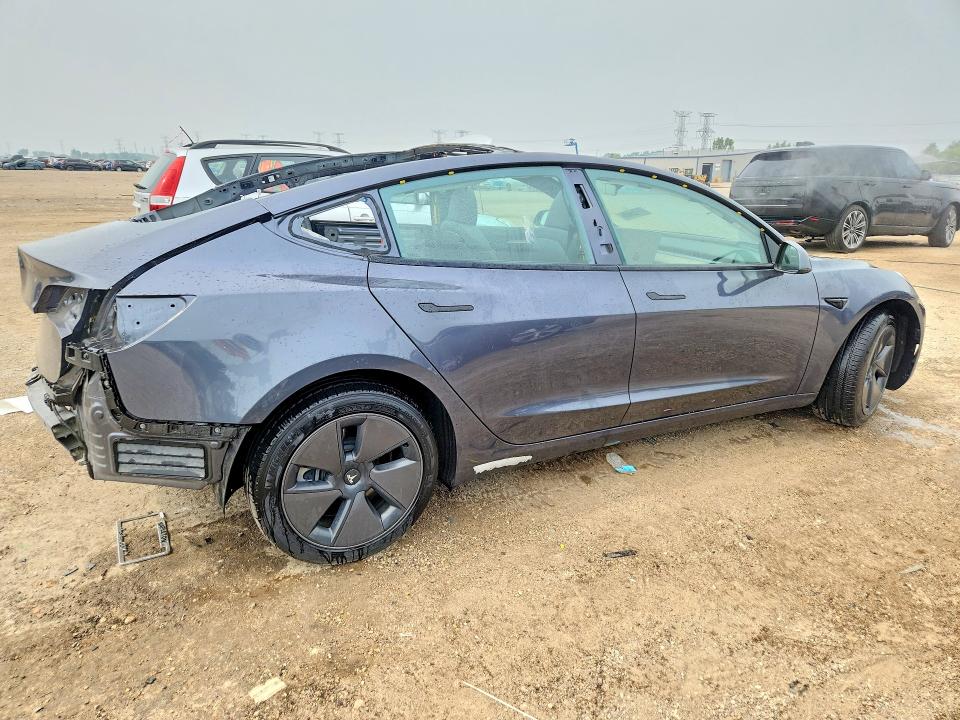 Photo 3 from auction – 2023 TESLA MODEL 3 with VIN 5YJ3E1EA4PF699232