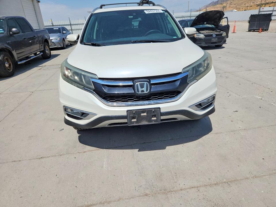 Photo 5 from auction – 2015 HONDA CR-V with VIN 5J6RM4H96FL008076