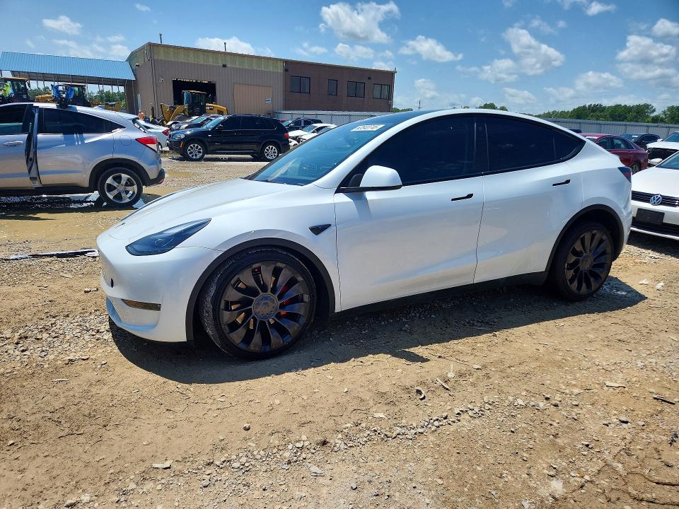 TESLA MODEL Y 2023 with VIN 7SAYGDEF6PF710408 - Photo from auction
